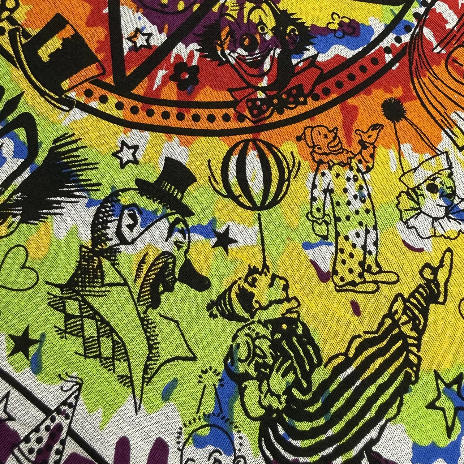Colorful fabric with clown and animal designs on a multicolored tie dye  background