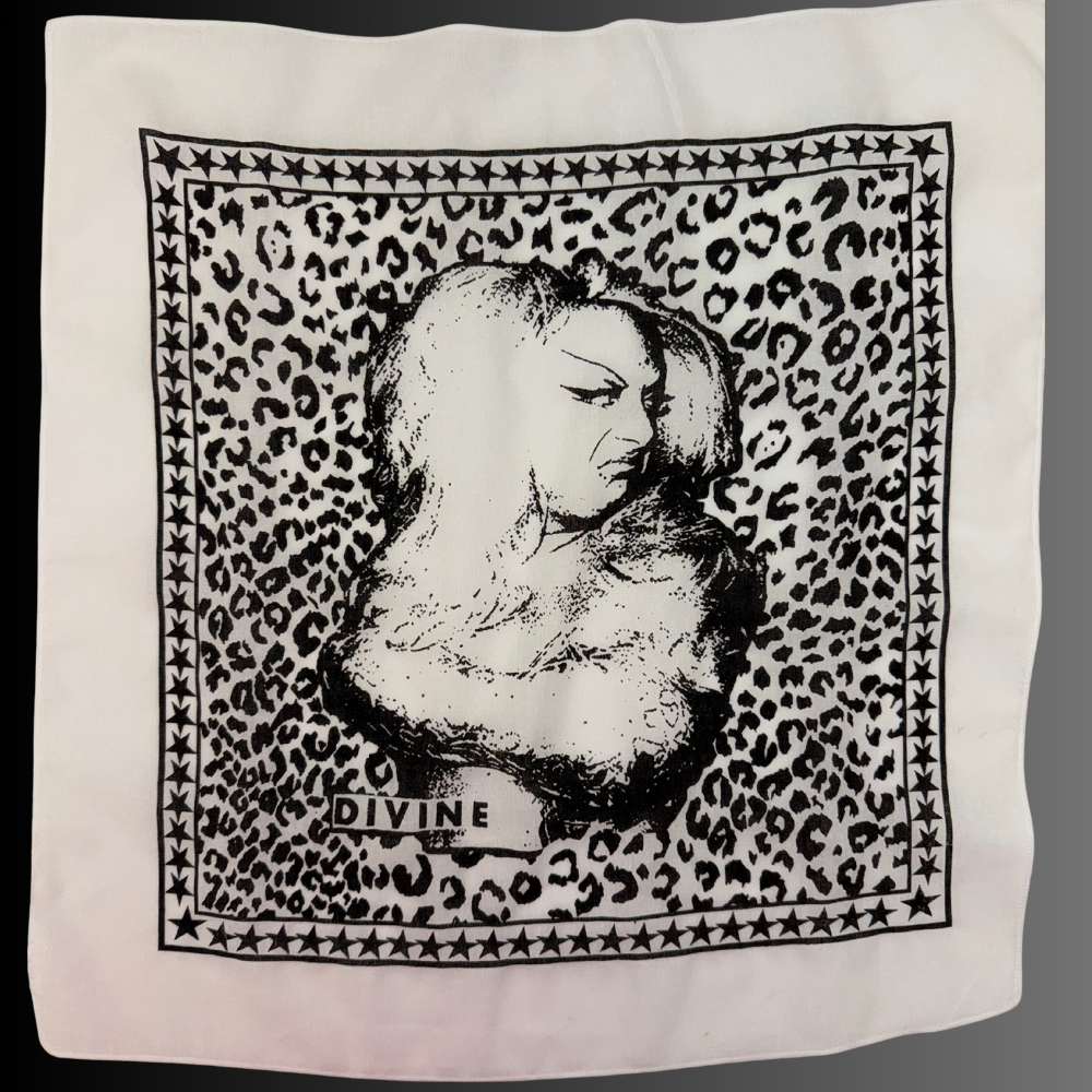 Hand-silk-screened cotton bandana featuring a portrait illustration of drag icon Divine printed in black ink on white fabric.